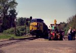 CSX 7673 has brought its train to a stop at Raleigh Street due to trackwork